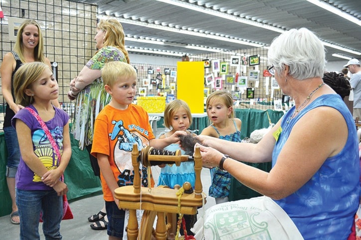 mly Harvest Fair youngsters watch spinner