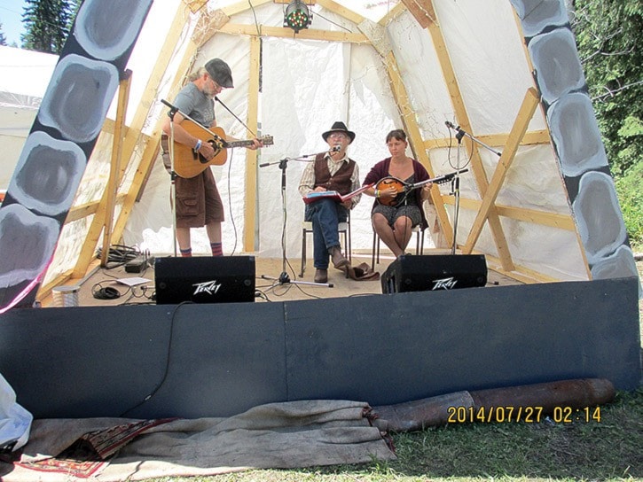 Caterina Geuer photo Sage Birchwater, Lorne Dufour, and Grace on mandolin.