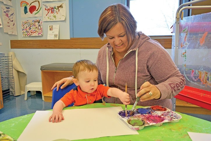 Declan Guichon and his mom Cassandra are enjoying the new space StrongStart is now housed in at Marie Sharpe Elementary School, December 2016.
