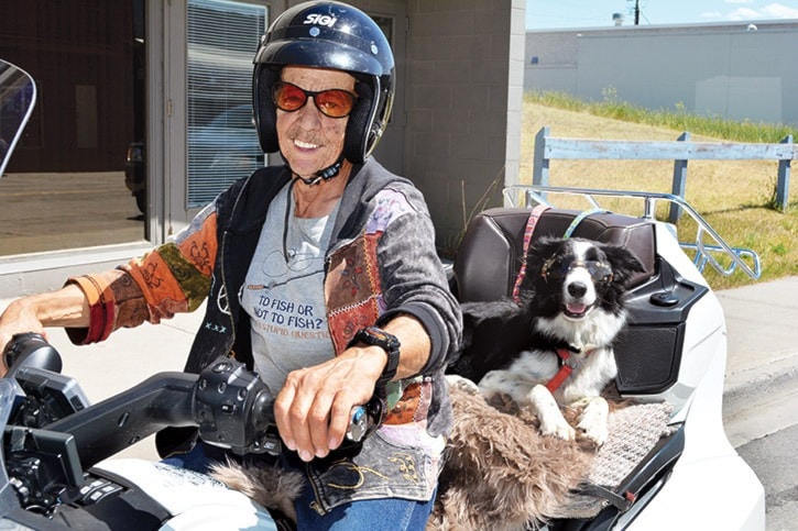 mly man and dog on motorcycle