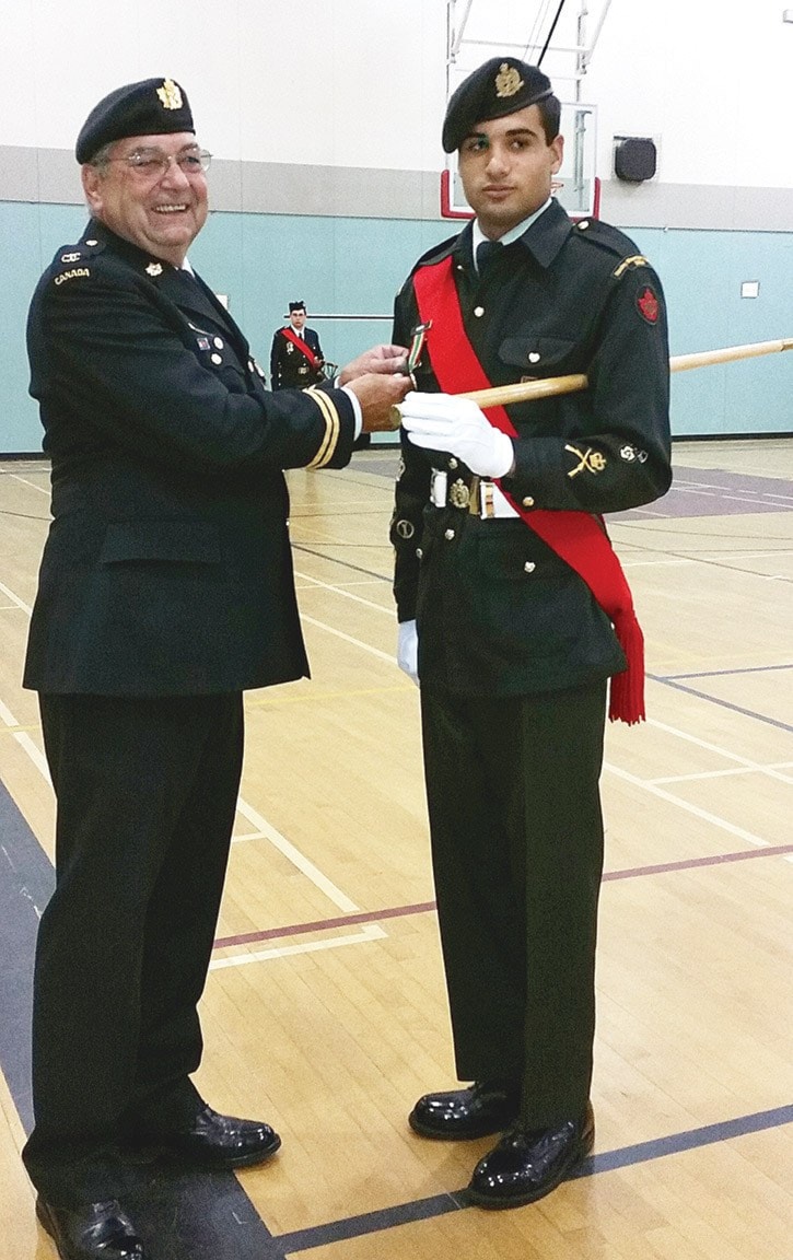 82594tribunea11-cadets-retire-WO-Sheldon-Samra-receives-the-Lord-Strathcona-Medal-from-Reviewing-Officer-Retired-Captain-Phil-Sullivan-in-June-2014.-jpg