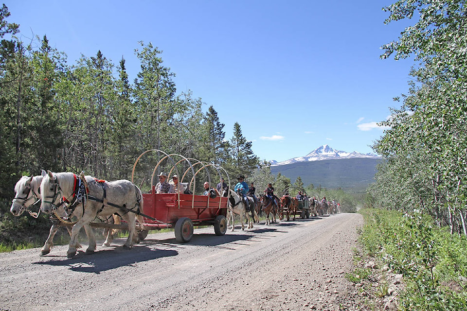 Day one: The Xeni Gwet’in Wagon Trip leaves Nemiah Valley with Mt. Tatlow (Tsi’il?os) in the background.