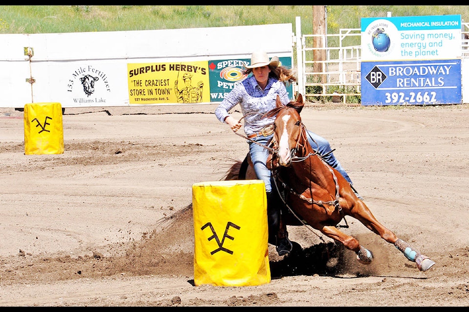 Williams Lake’s Shaylene Tucker rounds her first barrel on her run Sunday,