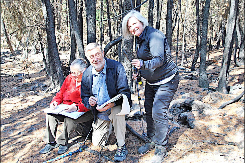 Gaeil Farrar photos Artists Cat Prevette (from the left), Dean Jeffries and Linda Bachman were among a small group of Cariboo Art Society members making an outdoor sketching trip to record the devastation and beauty left behind by the wildfires this summer on the Bachmans’ property. Their home was saved but they lost about half of the forest to the wildfires.