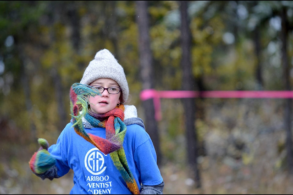 Maia Prest, a grade four student from Cariboo Adventist Academy, jogs through the cold at the cross-country run on October 13. Paige Mueller Photos