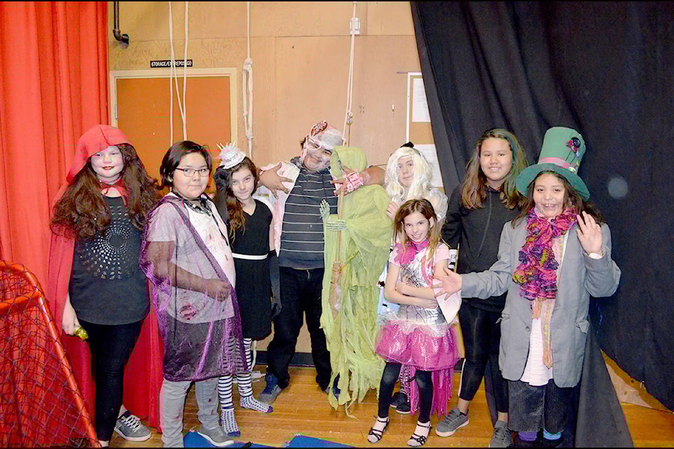 Maria Becker (left), Ava Boyd, Willamena Honeyman, Isidore Kalelest, Jessilyn O’Neil, Madison Gadsden, Queisha Johnson, and Lyndelle Kequahtooway scared student visitors to a haunted house at Marie Sharpe Elementary School on Tuesday.