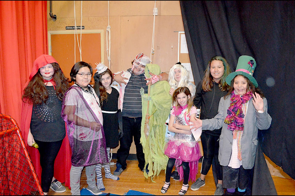 Maria Becker (left), Ava Boyd, Willamena Honeyman, Isidore Kalelest, Jessilyn O’Neil, Madison Gadsden, Queisha Johnson, and Lyndelle Kequahtooway scared student visitors to a haunted house at Marie Sharpe Elementary School on Tuesday.