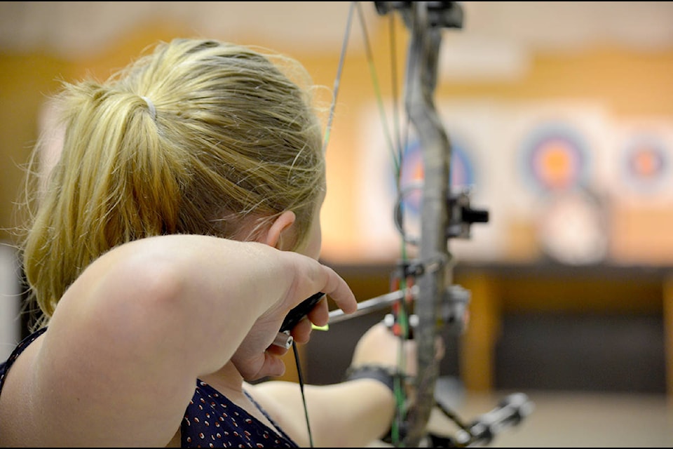 Taryn Hinsche sights along her arrow, hoping for an accurate shot.