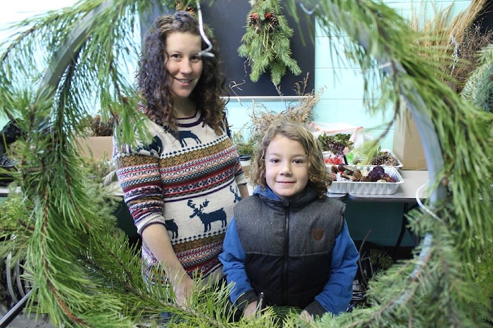 Tanis Armstrong and Payton Daum Armstrong pause for a moment from their busy wreath making at the Central Cariboo Arts Centre as part of the Earth Friendly Holiday Event. Tara Sprickerhoff photos