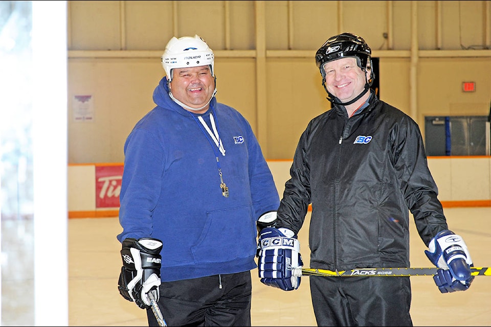 Williams Lake Minor Hockey Association coaches Roy Call and Troy Weil have been instrumental in carving out a path for female hockey players in Williams Lake. Angie Mindus photo