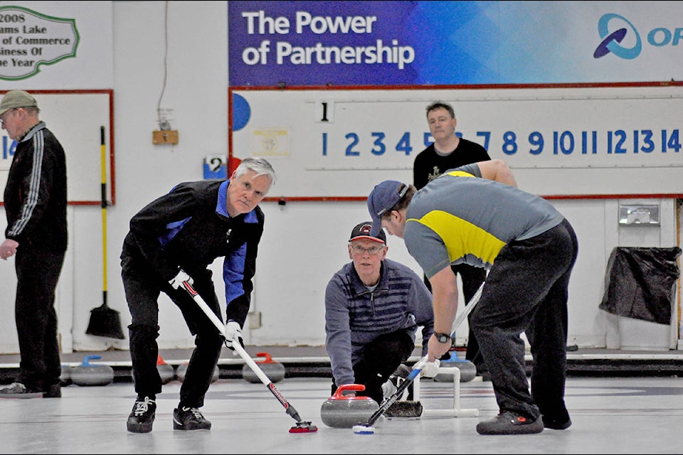 Ken Kvist throws a rock as second Bill Fawcett (left) and lead Todd Routtu sweet during the men’s ‘A’ final at the Williams Lake Curling Centre’s Men’s and Women’s Joint Bonspiel. (Greg Sabatino photos)
