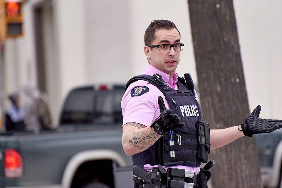 Williams Lake RCMP Const. Vandenberk talks to motorists involving in a minor vehicle incident in the downtown Wednesday.