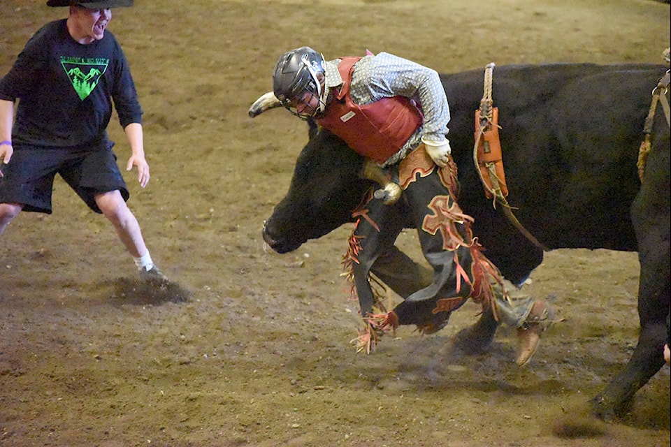 Desperate to help, bull fighter Ryan Jasper yells to try and turn the bull’s attention on to him so the rider may be able to escape.