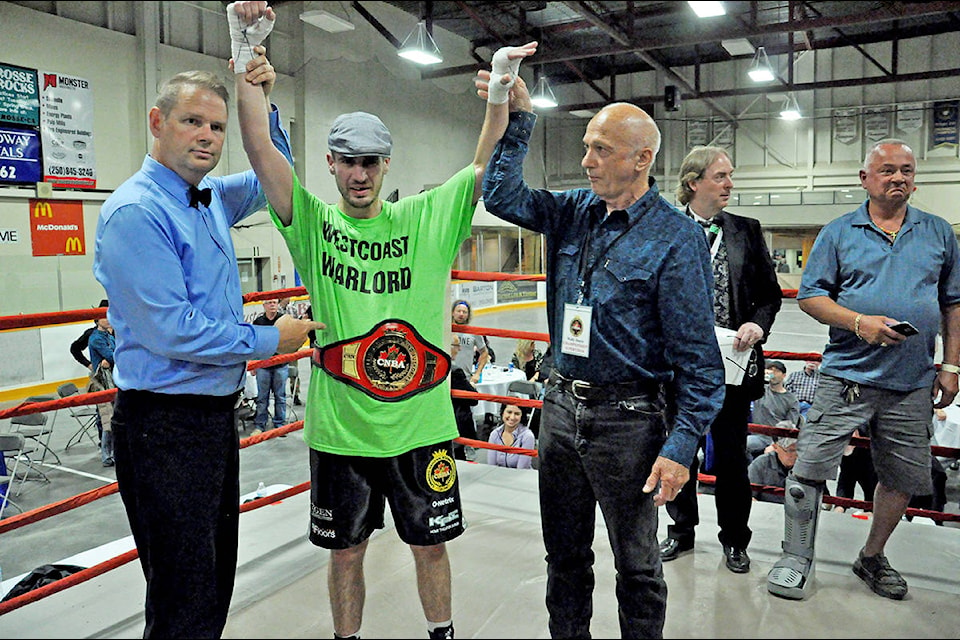 Williams Lake’s Stuart McLellan has his arm raised after his victory Saturday evening at Teofista Boxing’s Unfinished Business.