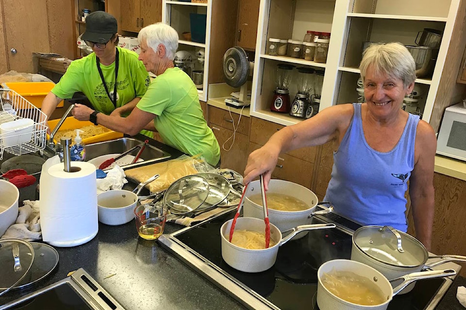 12821700_web1_2018BCSummerGamesVolunteerscooking2