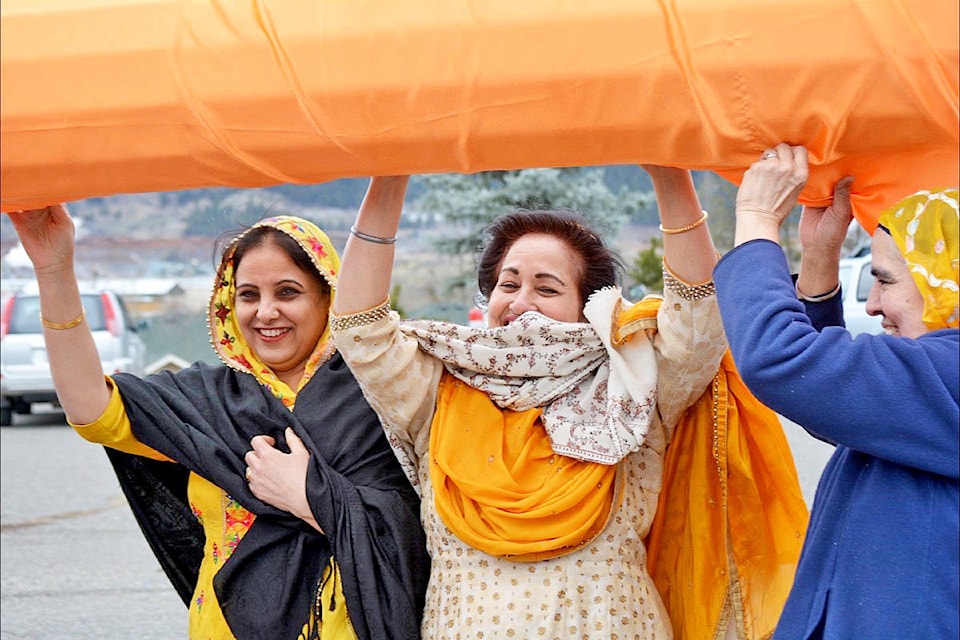 16257735_web1_180418-WLT-Vaisakhi-flagpole-wrapping