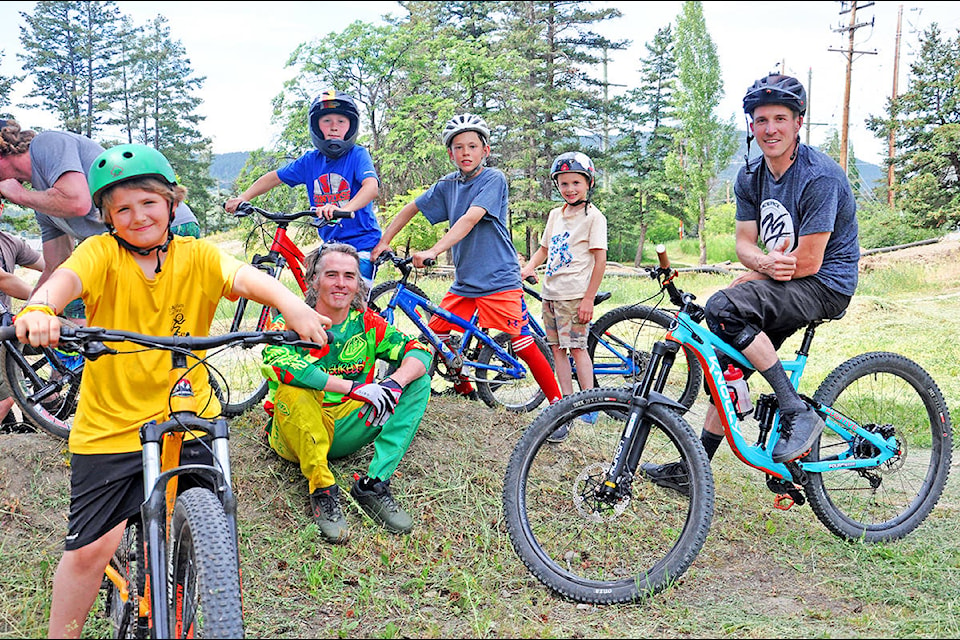 Alec Sanford (from left), 9, Red Shred’s Mark Savard, James Peterson, 9, Braden Huitema, 9, Aaron Sanford, 7 and lakecity pro mountain biker James Doerfling enjoy the afternoon during the Williams Lake Cycling Club and Red Shred’s Bike a Board Shed’s Father’s Day Bike Jam in Boitanio Park. (Greg Sabatino photo)