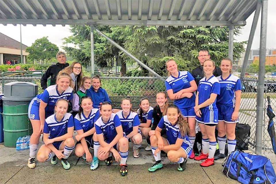 Photo submitted The Williams Lake FC U18 girls team of Morgan Worthington (from left), Angie Lewington, Taylor Wessels, Brooke LeRoy, Pyper Alexander, Tiana Brenner, Bronwyn Pocock, Emma Taylor, Jaymie Grove, Jessica Rowley, Lina Fankhauser, Georgia DiMarco, Dylan Passeri, Maria DiMarco, coach Daryl Taylor (back right) and assistant coach Marco Passeri (back left).