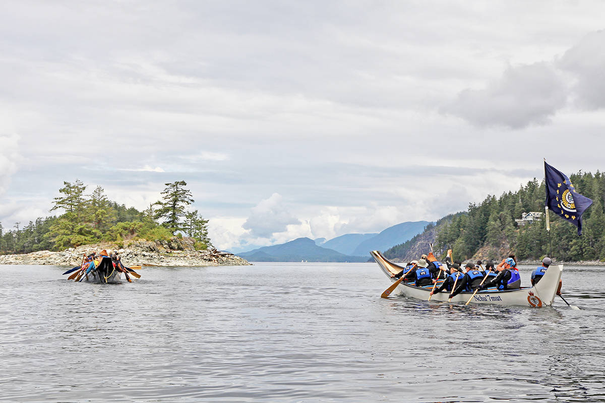 17685862_web1_Cynthia-Paul-paddles-in-the-VPD-canoe-right-in-the-Pulling-Together-Canoe-Journey