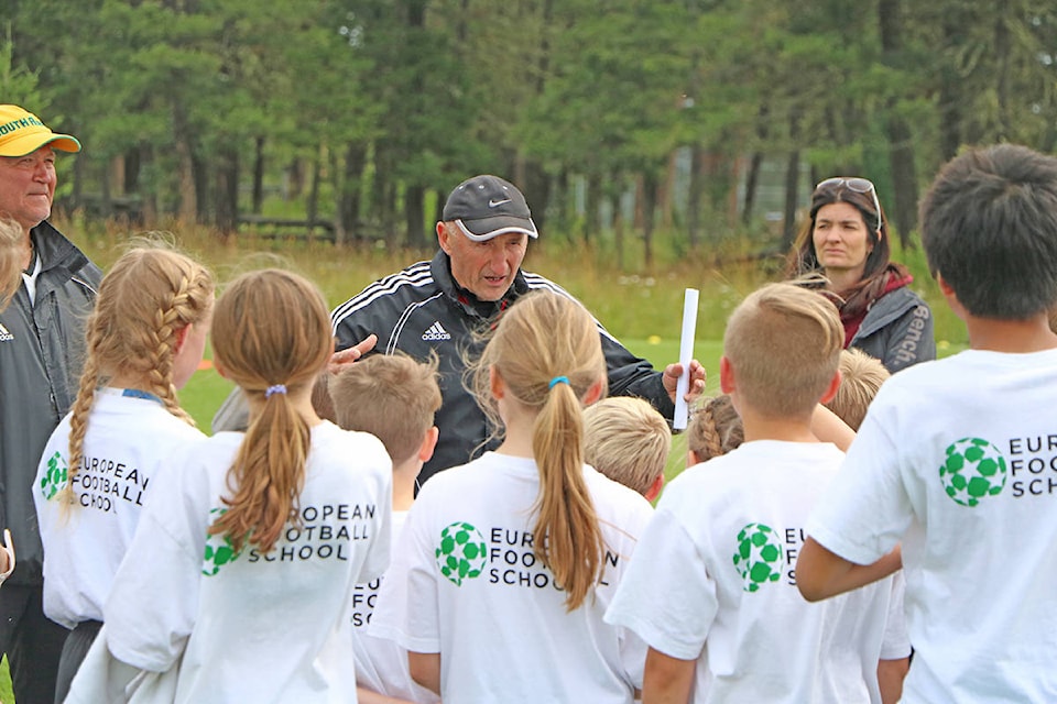 Saibo Talic (centre) the head coach of the European Football School gives one final pep talk to the U7 to U12 group at the conclusion of their 2019 training on Friday, July 19. Patrick Davies photo