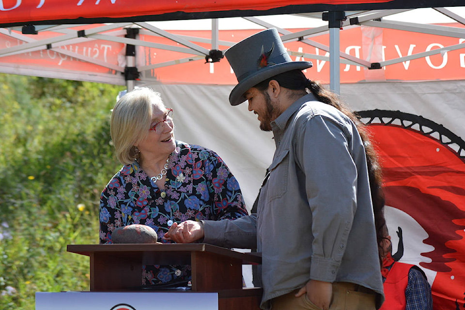 Honourable Carolyn Bennett, federal Minister of Crown-Indigenous Relations adds her paint mark to a rock while Tsihlqot’in cultural ambassador Peyal Laceese shows her how it’s done. Bennett was in Williams Lake Wednesday to celebrate signing the Gwets’en Nilt’i Pathway Agreement with the Tsilhqot’in Chiefs and the B.C. Government. Monica Lamb-Yorski photo