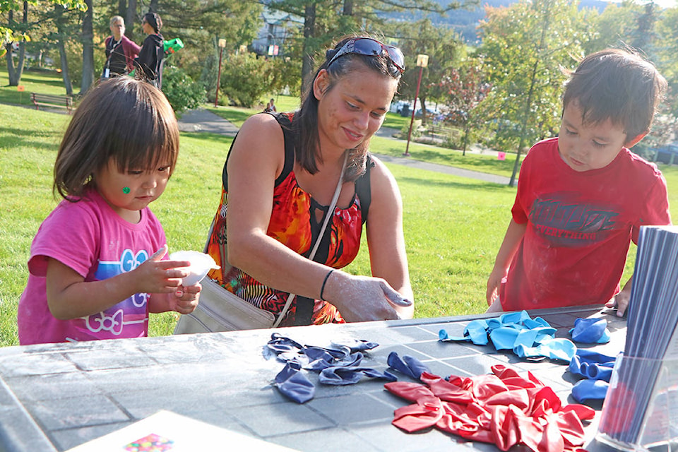 Patrick Davies photos Little Katilayah Heward (from left) makes stress balls with her mother Tiffany Orgill and brother Kane Heward at Take back the Night 2019. Orgill said her family recently moved to Williams Lake from Chilliwack and saw the event as a great way to get to know the lakecity community.