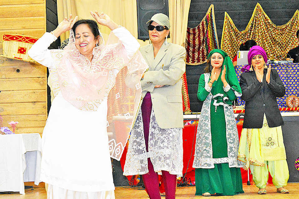 Monica Lamb-Yorski photo Harjinder Nijjar (left), Paramjit Mangat, Pwandeep Sra and Kulwinder Mangat perform a traditional Punjabi folk dance during the Lights for Life charity festival fundraiser held at the Elks Hall Saturday, Oct. 5. For more see Page A11.