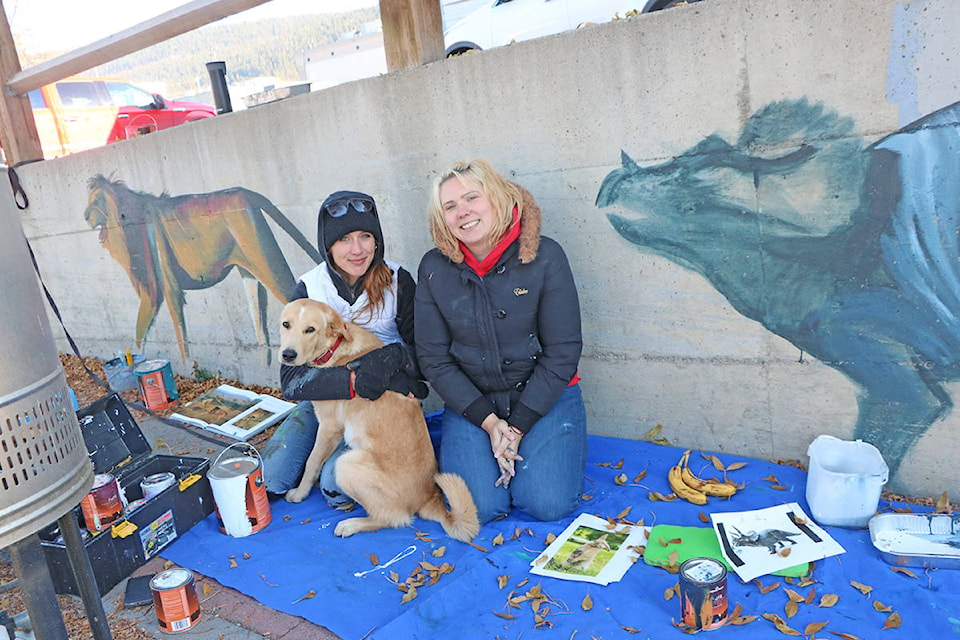 Patrick Davies photo For the last week, Tiffany Jorgensen and Sarah Sigurdson have been painting a collection of fantastical animals walking into town by Downtown Williams Lake’s office while being kept company by Jorgensen’s dog, Otto.
