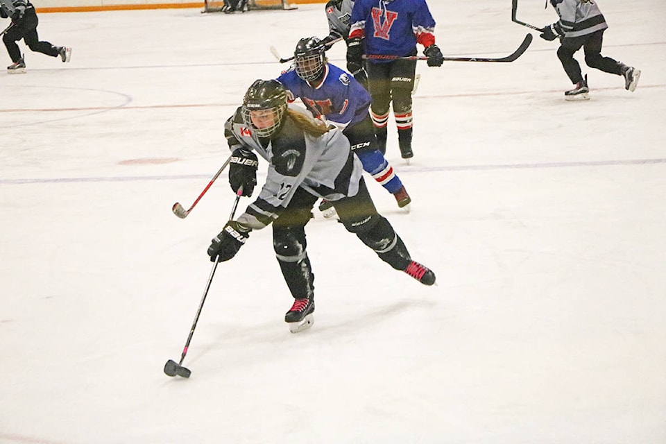 Patrick Davies photo Williams Lake Female Timberwovles player Keira Vermeulen speeds away from a Vanderhoof opponent during a 2-1 victory Friday night in the lakecity. The Timberwolves were hosting a super weekend in Williams Lake Oct. 18-19. Playing three games in two days, the Timberwolves opened with a 2-1 victory over Vanderhoof on the strength of two goals from Avery Batista. They then tied Fort St. John Saturday morning 2-2 where, again, Batista notched two in the outing. Williams Lake closed out its weekend with a 3-1 defeat versus Kamloops. Cricket Colebank scored the lone goal for the T-wolves.