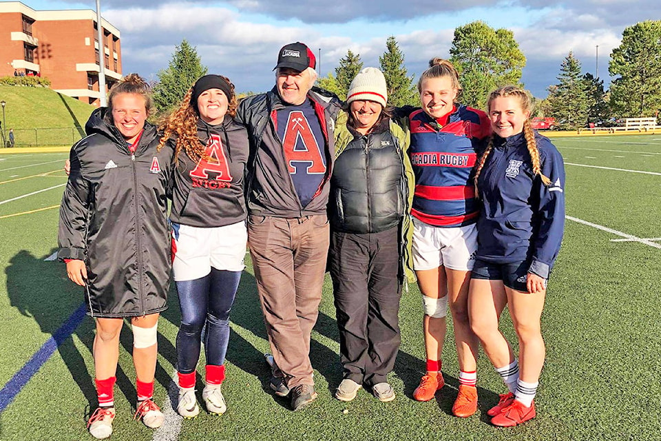 Acadia Axewomen players Laura Pfleiderer (from left), Skye Forcier and Emma Pfleiderer (second from right), join former Lake City Falcons teammate Carleigh Walters of St. Francis Xavier (right) during a visit from Foricer’s parents Troy Forcier and Ingrid Kallman this season. (Photo submitted)
