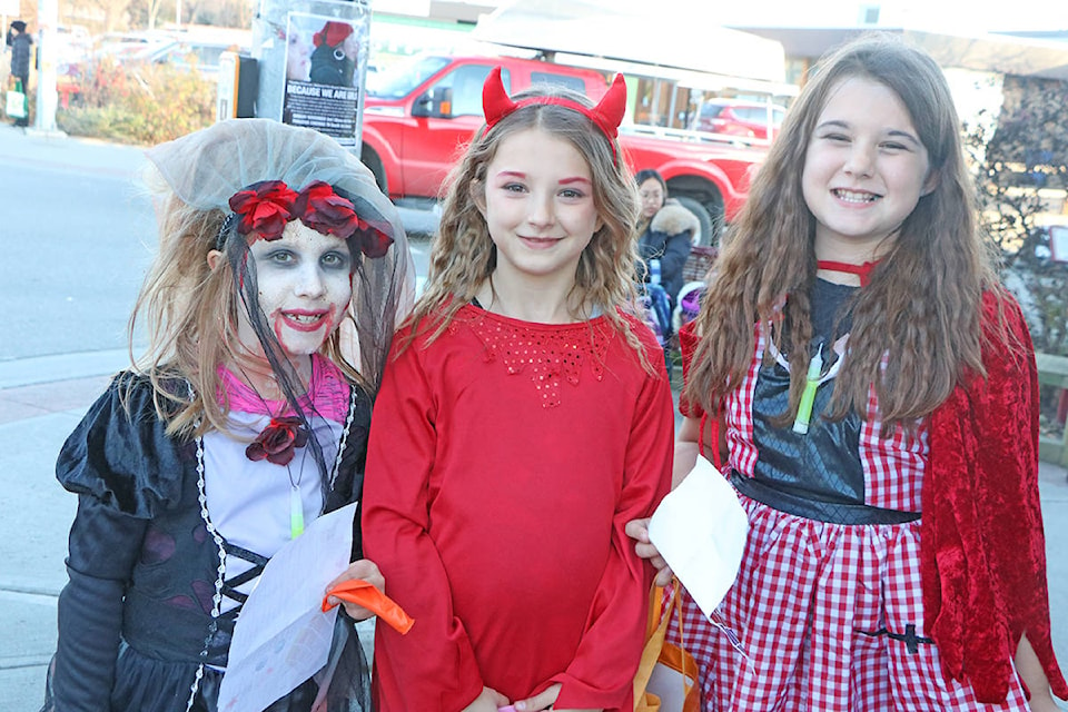 Leena Peeman (from left) was out enjoying Downtown Trick’Treat with her friends, sisters Tiri and Ryley Gerlinsky. Patrick Davies photo.