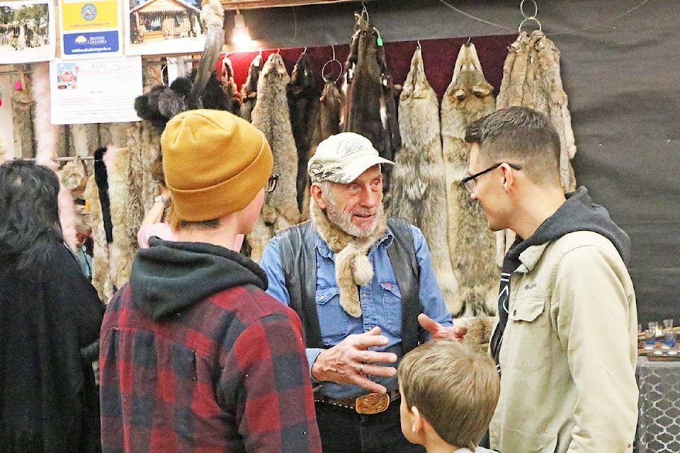 Friedrich ‘Fritz the Trapper’ Dieck shares tales of his exploits with potential customers while selling furs at Carmen’s Early Bird Christmas Craft Fair. Patrick Davies photo.