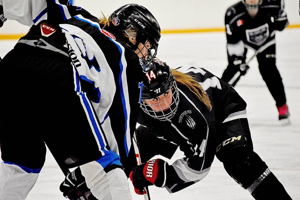 Williams Lake Midget Female Timberwolves player Sara Vermeulen is all focus as she squares off for a draw in the offensive zone Sunday morning. (Greg Sabatino photos)