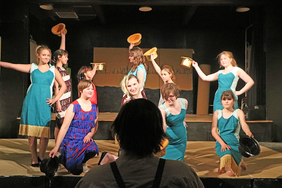 The cast of Give My Regards to Broadway includes Ariana Dyck (from left), Skyla Zaworski, Page Zaworski, Erin Getson, Danielle Edinger, Kielle Shaver, Alexis Mccomber, Hannah Ragan, El Crews and Naomi Greig seen here performing a musical number for their in-play director Dick played by Tian Walker (centre). Patrick Davies photo.