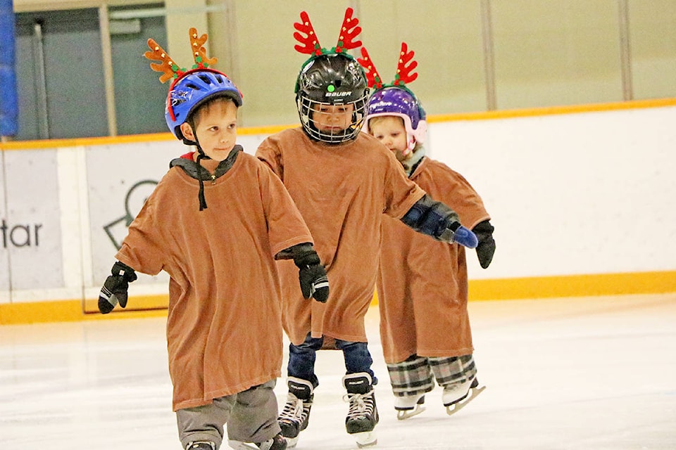 The Williams Lake Skating Club’s youngest CanSkate members Decklin Bailey (from left), Shepard Murphy-Lulua and Hadley Parkin take to the ice during the club’s annual Christmas Showcase. (Patrick Davies photo - Williams Lake Tribune)