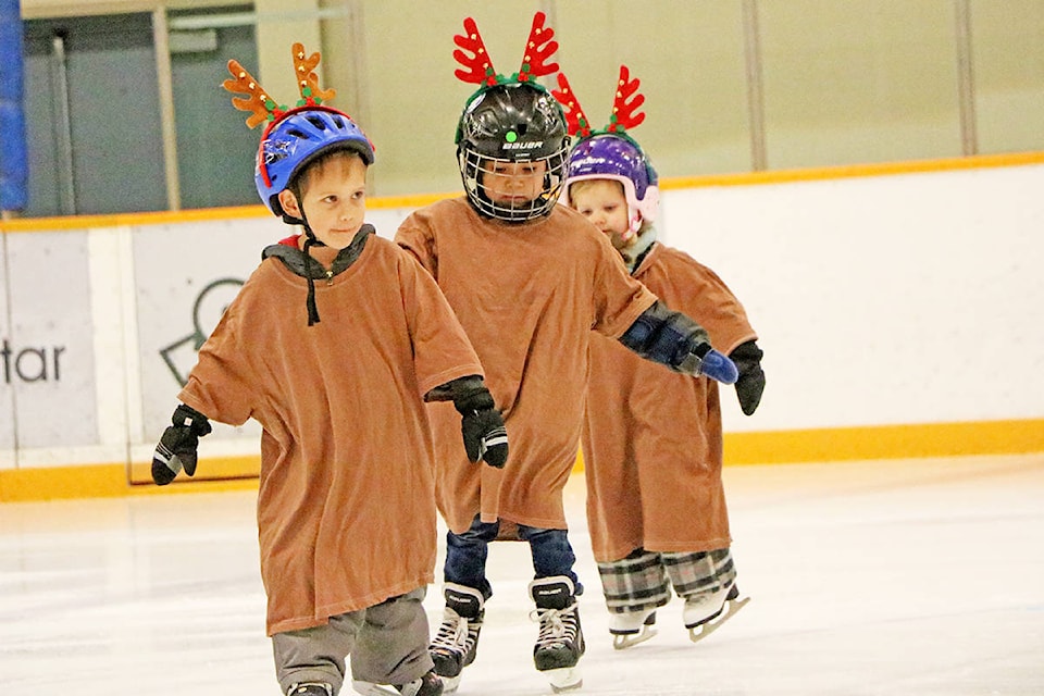 The Williams Lake Skating Club’s youngest CanSkate members Decklin Bailey (from left), Shepard Murphy-Lulua and Hadley Parkin take to the ice during the club’s annual Christmas Showcase. (Patrick Davies photo - Efteen)