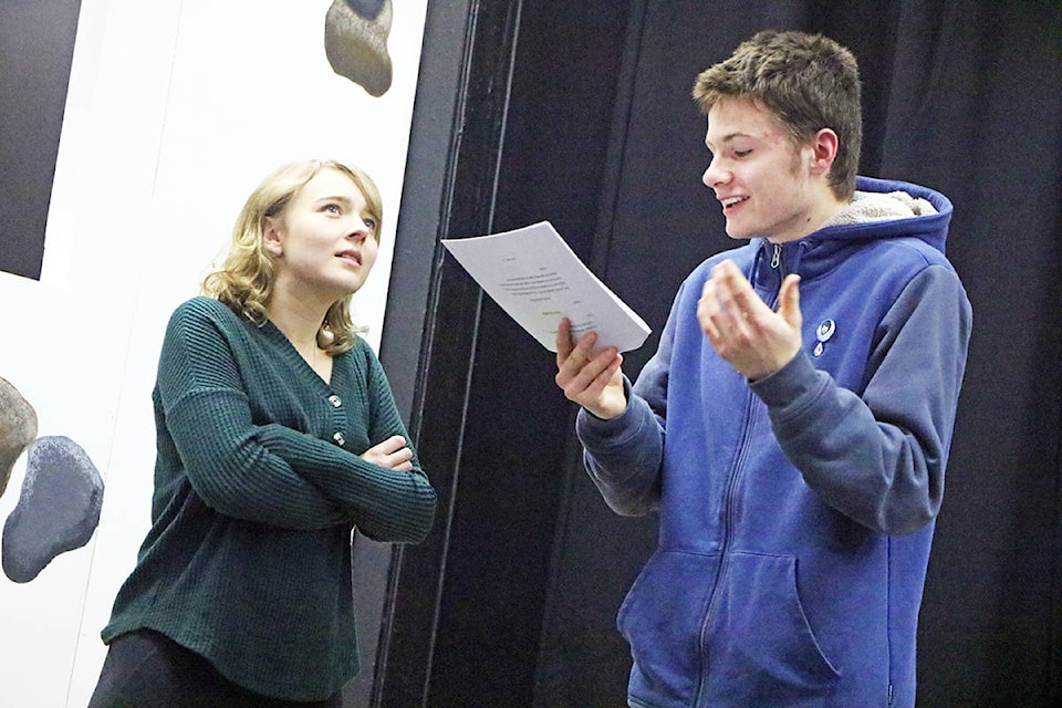 Jenny McPhee stares off into the distance as she acts as an astonished witness to the great tragedy that is ‘night’ while Gavin McKimm, playing a scrappy news reporter, interviews her. (Patrick Davies photo-Williams Lake Tribune)