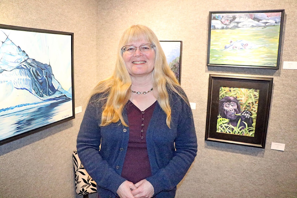 Lyn Capling is the artist behind Our Beautiful Resilient Planet, a series of paintings that captures and celebrates all the planet has to offer. (Patrick Davies photo - Williams Lake Tribune)