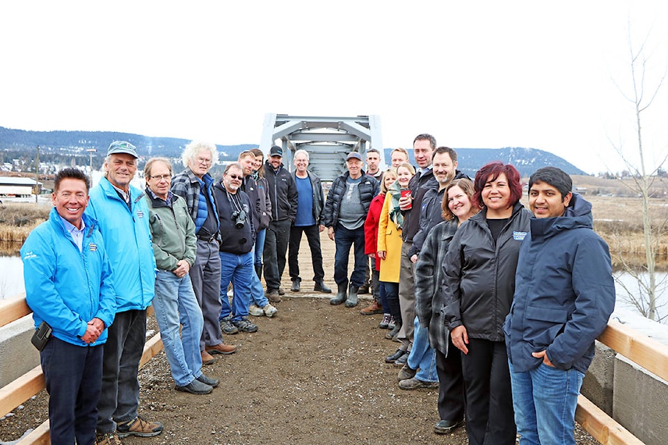 Representatives of the public, contractors, City Council and Williams Lake Field Naturalists all were on hand to commemorate the soft opening of the new bridge on Scout Island. (Patrick Davies photo - Williams Lake Tribune)