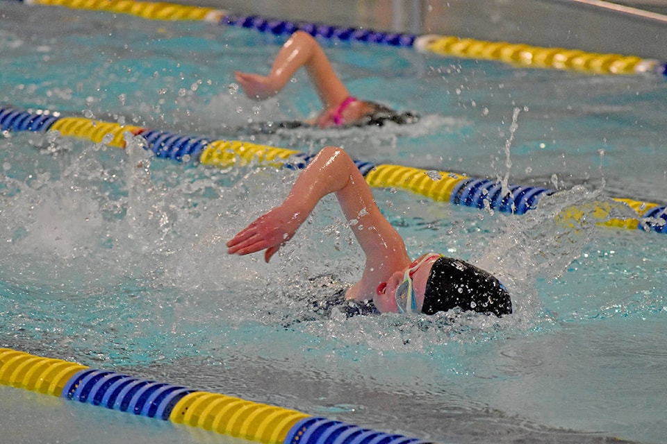 Williams Lake Blue Fins Annica Stalker (left) and Hazel Pare go neck and neck in the mixed 50-metre freestyle event Sunday during their home Cariboo Dental Swim Meet at the Sam Ketcham Memorial Pool. In all, upwards of 100 swimmers — 75 from out of town — took part in the event. For more see page A22. (Greg Sabatino photo - Efteen)
