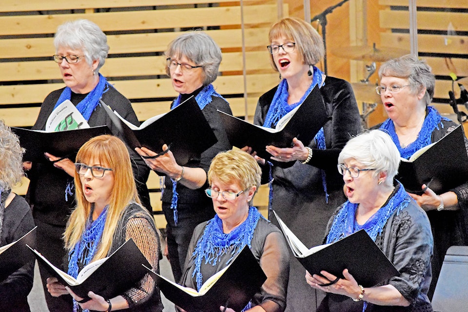 Quintet Plus choir members Marlene Anderson (back from left), Jean Oke, Joyce Lawrence, Janice Green, Macky Pierce (front from left), Margaret Willard and Jan Toews perform at the 13th Annual Parade of Choirs in support of the Hough Memorial Cancer Society. For more see page A17. (Greg Sabatino photo - Williams Lake Tribune)