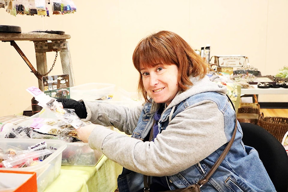 Kelly Houston checks out some supplies at the second annual Destash your Craft Supply Sale. (Patrick Davies photo - Williams Lake Tribune)