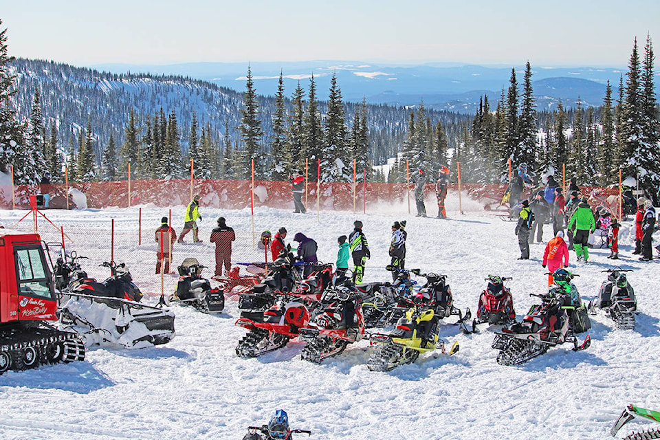 Participants gather around to spectate as racers line up for their events during the Williams Lake Powder Kings Snowmobile Club’s annual Yanks Peak Family Fun Day this past Saturday. (Maryclaire Snowball photos)