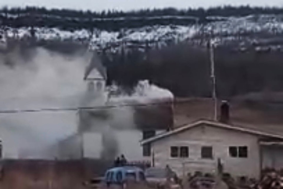 The Catholic church at Yunesit’in First Nation caught fire Thursday evening. (Lennon Solomon photo)