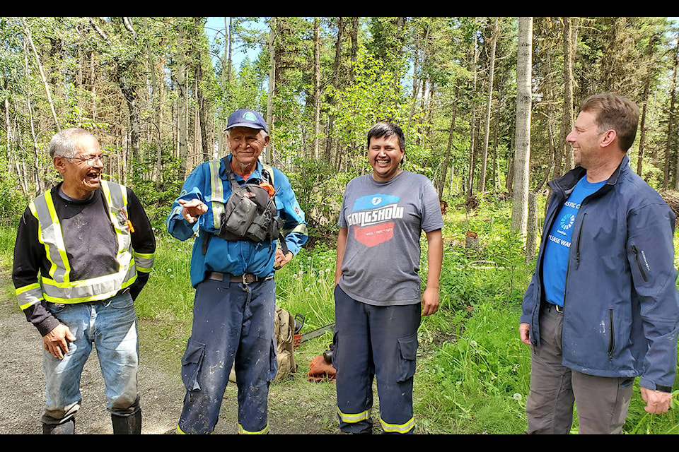 Alkali Resource Management’s Chuck Johnson (left), Doug Johnson, Kyle Paul and Gord Chipman connect at the end of a work day on Fox Mountain where the crew has been doing fuel management work. (Monica Lamb-Yorski photo - Williams Lake Tribune)