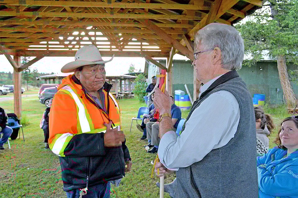 Esk’etemc traditional wellness co-ordinator Fred Johnson Sr. presents Williams Lake Mayor Walt Cobb with a talking stick at the Esk’et Arbor on Tuesday, July 7. (Monica Lamb-Yorski photo - Efteen)