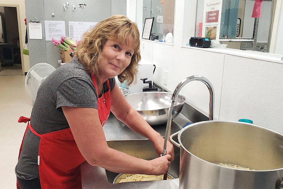 Salvation Army food bank co-ordinator and soup kitchen manager Tari Davidge washes macaroni for a salad. (Monica Lamb-Yorski photo - Williams Lake Tribune)