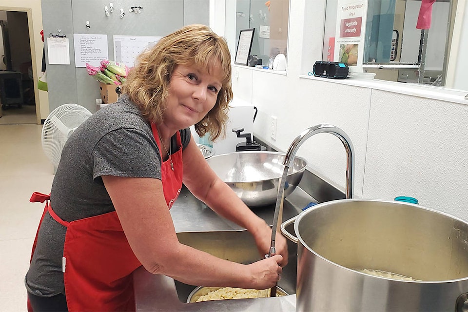 Salvation Army food bank co-ordinator and soup kitchen manager Tari Davidge washes macaroni for a salad. (Monica Lamb-Yorski photo - Efteen)