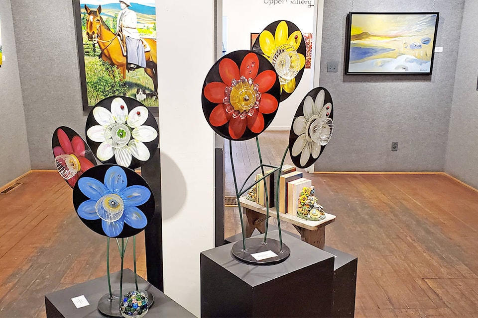 The summer exhibit in the Station House Gallery features works by members of the Cariboo Arts Society, which was formed 75 years ago. In the forefront is Anne Brown’s Whimsical Garden, to the left is Dwayne Davis’s Carr in the Cariboo and on the right is Jean Wellburn’s (Monica Lamb-Yorski photo)