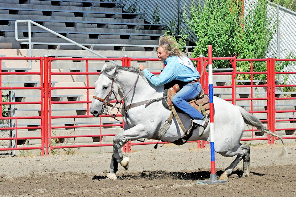 Riata Seelhof of Horsefly speeds around the pattern during the senior girls poles event Sunday at the Williams Lake Little Britches Rodeo. (Greg Sabatino photo - Williams Lake Tribune)